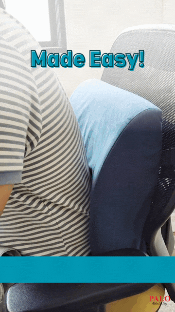 Office worker using an orthopedic backrest for lumbar support.
