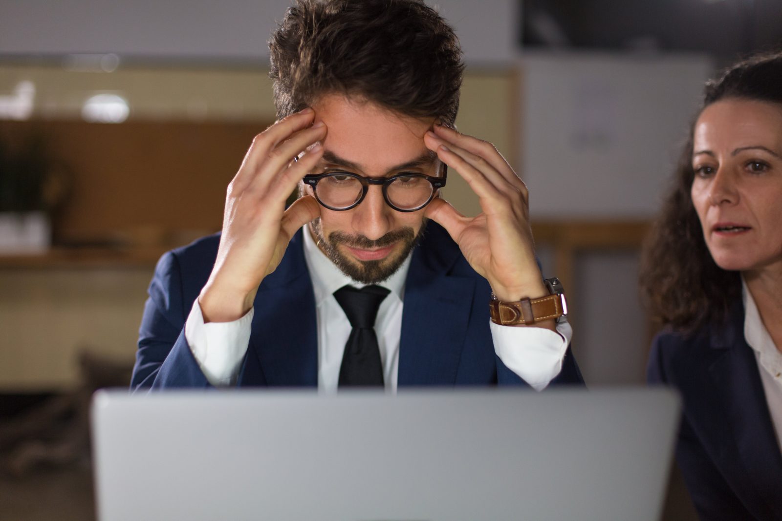 Executive focused on sensitive data, highlighting need for screen privacy in high-stakes environments